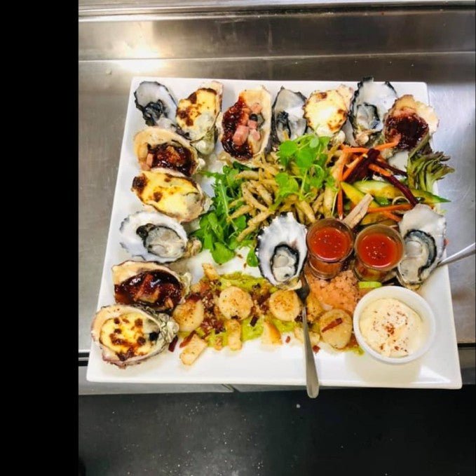 Experience Dinner At Secrets By The Sea - We Wander